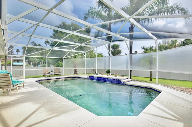 view of swimming pool featuring a patio, a lanai, and pool water feature