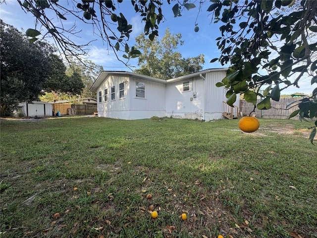 view of home's exterior featuring a storage shed and an outdoor structure