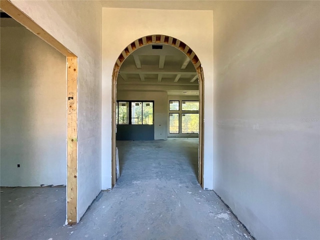 hallway with concrete floors