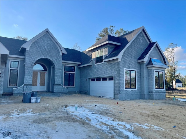 view of front facade featuring french doors and a garage