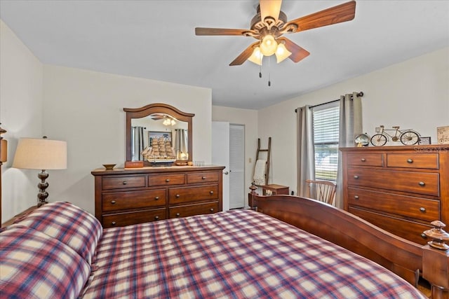 bedroom with ceiling fan and a closet