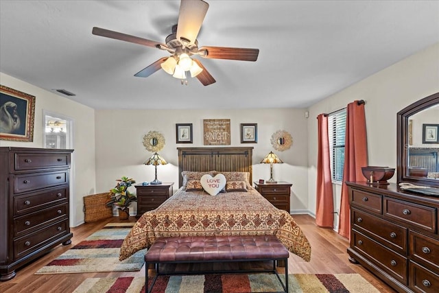 bedroom featuring light wood-type flooring and ceiling fan