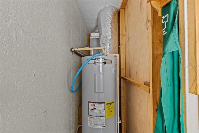 utility room featuring water heater