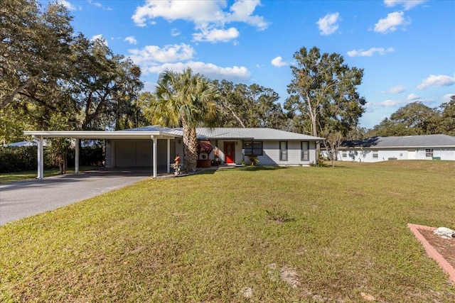 ranch-style home featuring a carport and a front yard