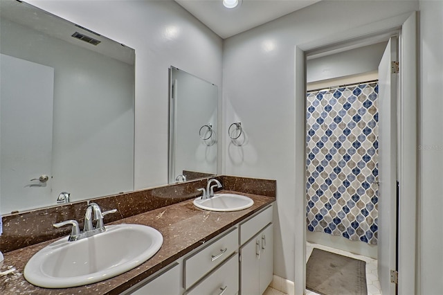 bathroom with vanity and a shower with shower curtain