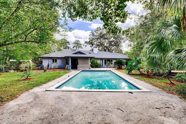 view of swimming pool with a patio