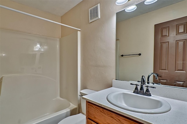 full bathroom with shower / washtub combination, vanity, and toilet