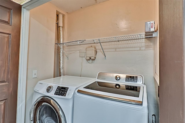 laundry room featuring washing machine and dryer