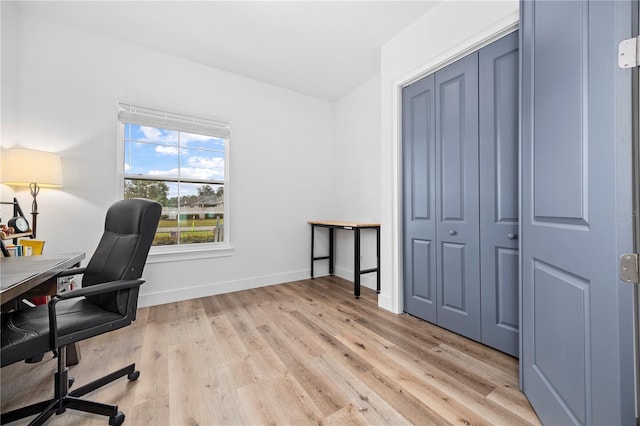 office with light hardwood / wood-style floors