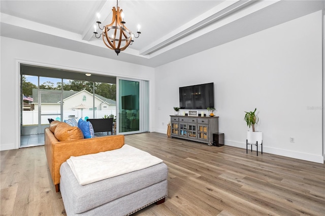 living room featuring a chandelier and hardwood / wood-style flooring