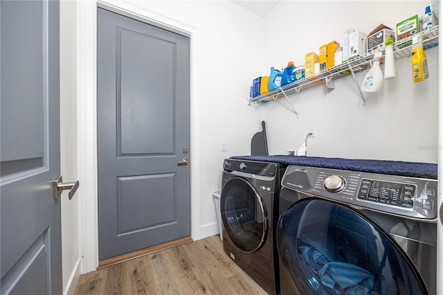 laundry room featuring light hardwood / wood-style flooring and independent washer and dryer