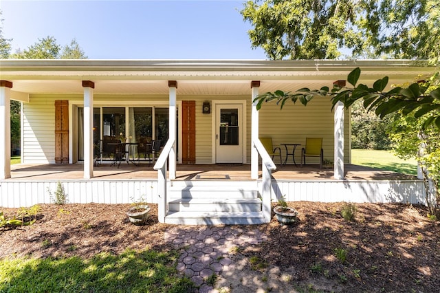 back of property with a porch