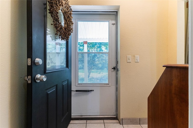 doorway featuring light tile patterned floors