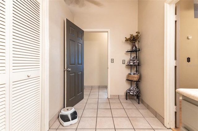 corridor with light tile patterned floors