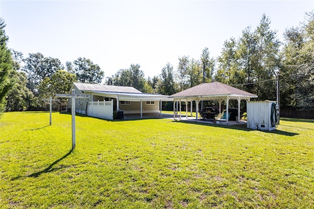 exterior space featuring a yard, a gazebo, and a patio area