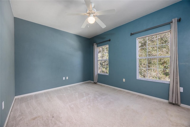 carpeted empty room with ceiling fan