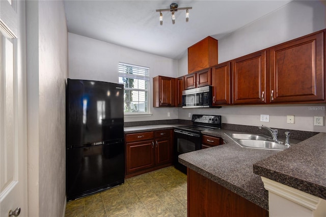 kitchen featuring black appliances, kitchen peninsula, and sink