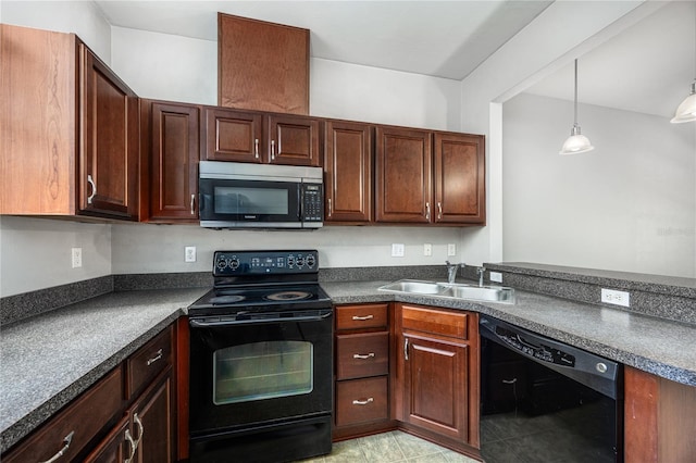 kitchen with black appliances, decorative light fixtures, and sink