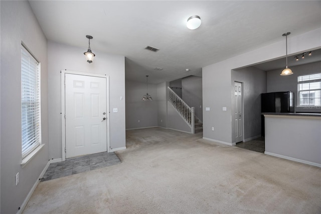 entryway with light carpet