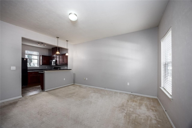 interior space featuring light colored carpet