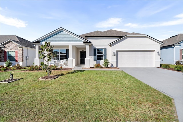 view of front of property with a front lawn, a garage, and covered porch