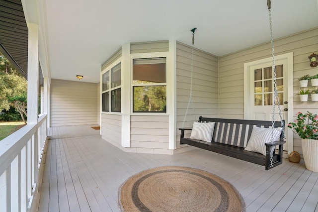 wooden terrace with a porch