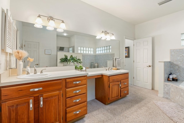 bathroom with a tub to relax in and vanity