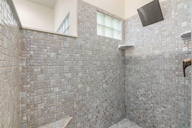 bathroom with tiled shower