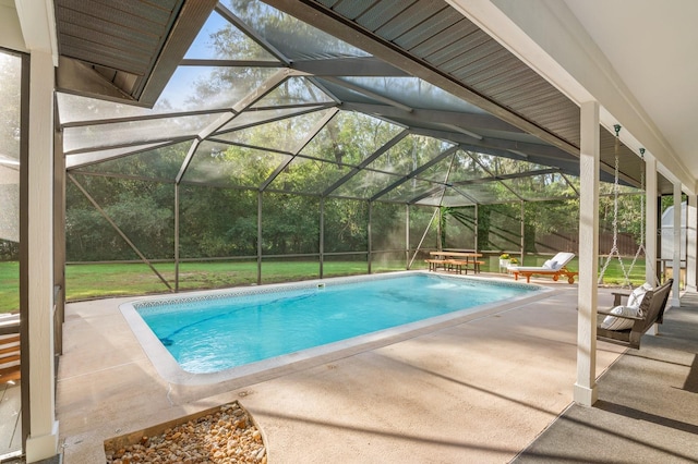 view of swimming pool featuring pool water feature, a lanai, and a patio area