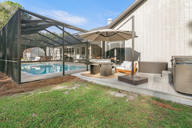 view of pool with glass enclosure