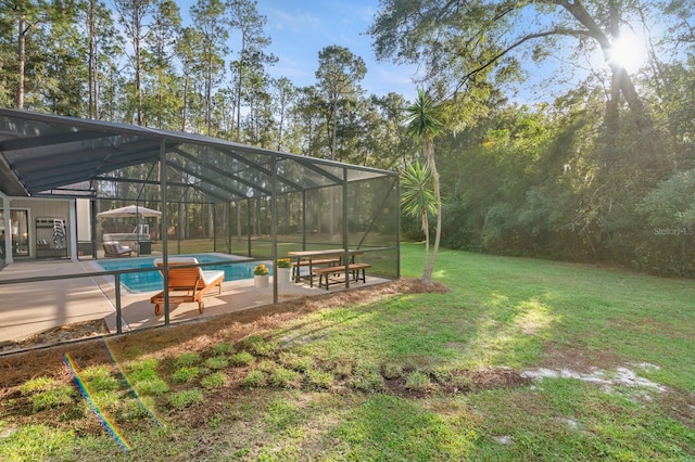 view of yard featuring a lanai and a patio