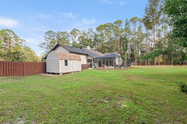 view of yard featuring a shed and a lanai