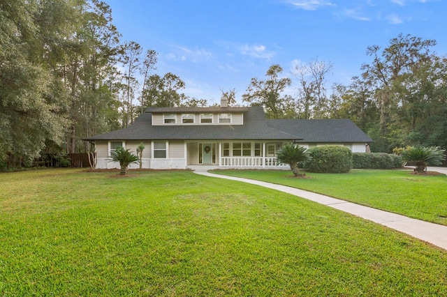 view of front facade with a front yard and a porch