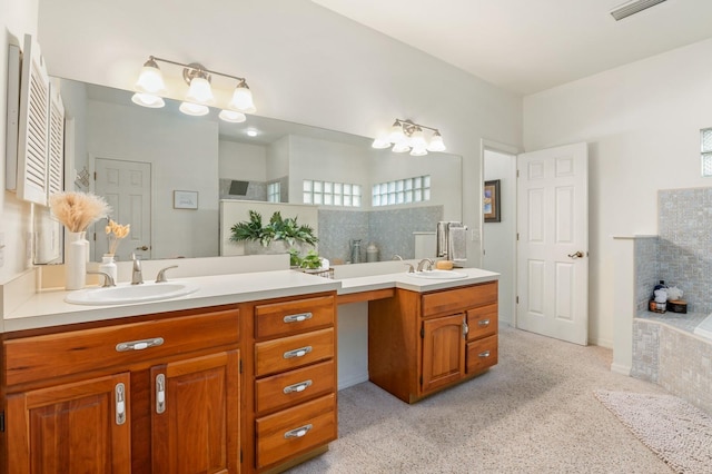 bathroom featuring vanity and a washtub