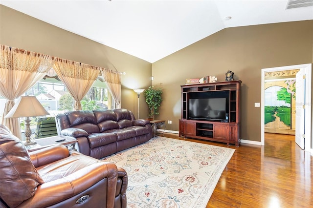 living room featuring lofted ceiling and dark hardwood / wood-style floors