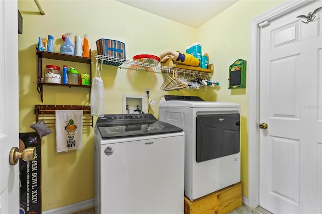 laundry room featuring washing machine and dryer