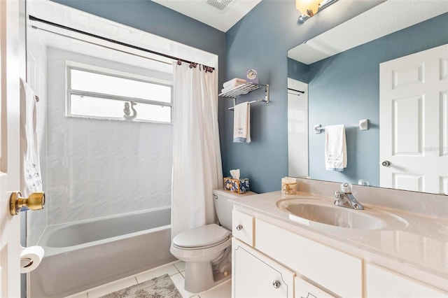 full bathroom featuring toilet, vanity, tile patterned flooring, and shower / bath combo with shower curtain