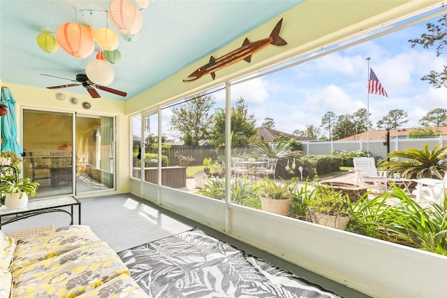 sunroom / solarium with ceiling fan