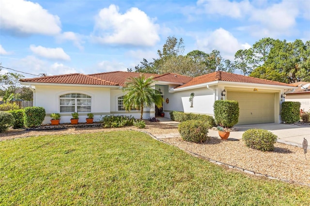 mediterranean / spanish-style house featuring a front yard and a garage