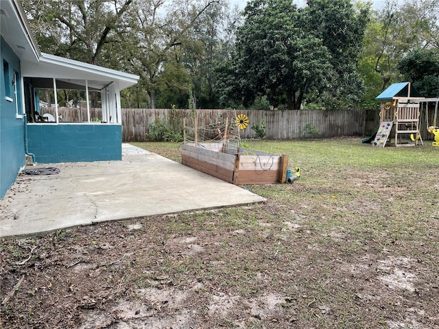 view of yard with a patio and a playground