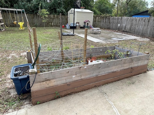 exterior space featuring a storage shed and a patio area