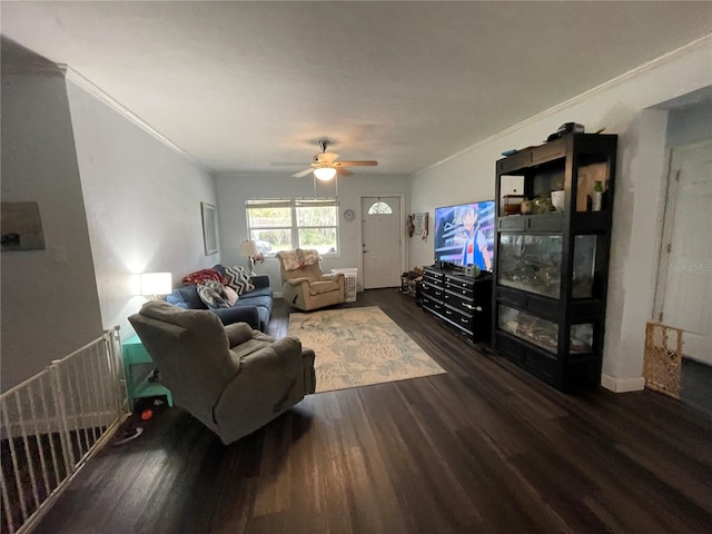 living room with ceiling fan, crown molding, and dark hardwood / wood-style flooring