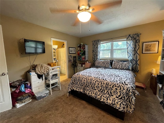 bedroom featuring a textured ceiling, carpet, ceiling fan, and connected bathroom