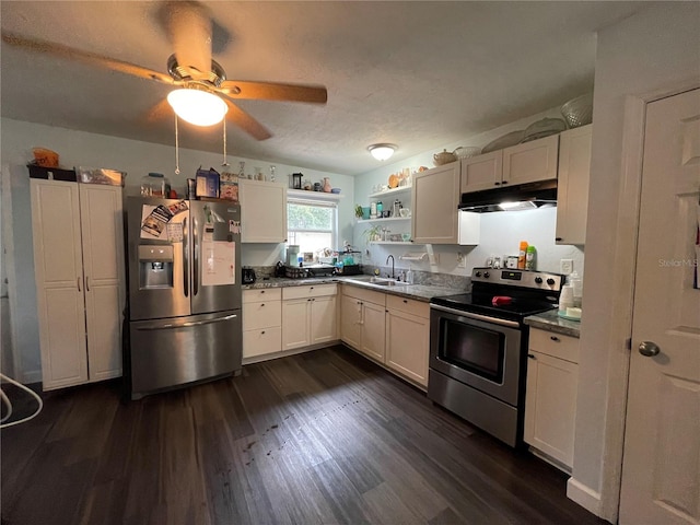 kitchen with white cabinets, stainless steel appliances, sink, and dark hardwood / wood-style floors