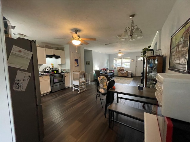 living room featuring ceiling fan with notable chandelier and dark hardwood / wood-style flooring