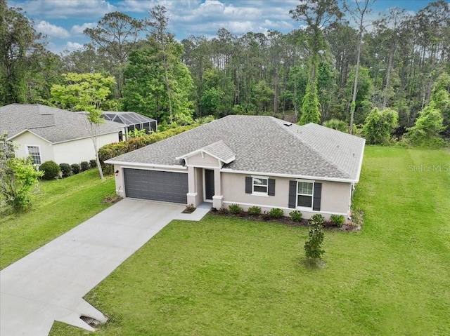 view of front of property featuring a garage and a front yard