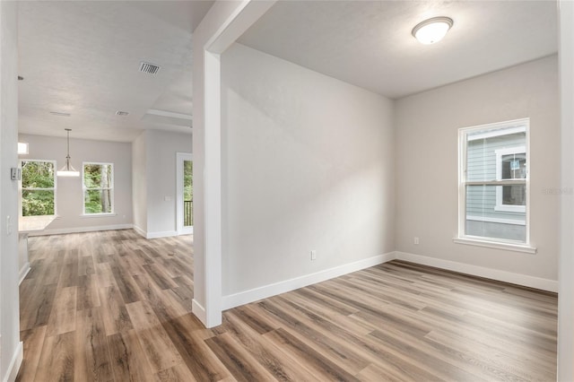 empty room featuring hardwood / wood-style flooring