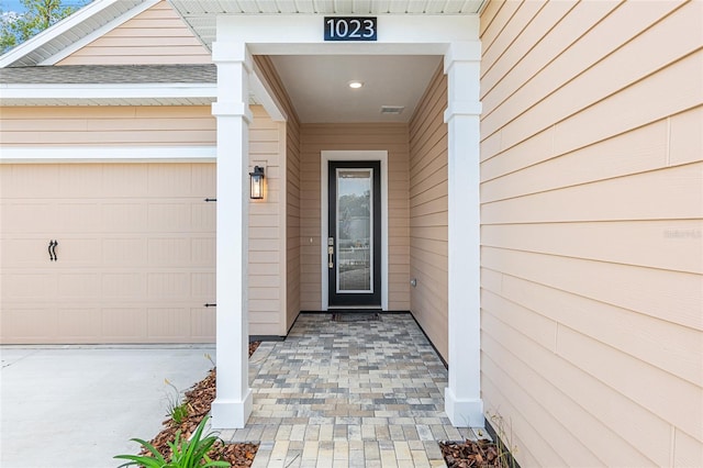 1023 NW 132nd Blvd, Newberry, FL 32669 - doorway to property with a garage and a shingled roof
