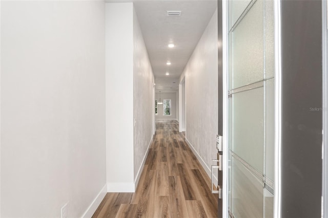 1023 NW 132nd Blvd, Newberry, FL 32669 - hall with wood finished floors, recessed lighting, and baseboards