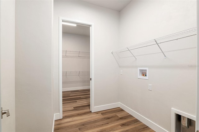 laundry room with hookup for a washing machine and hardwood / wood-style flooring